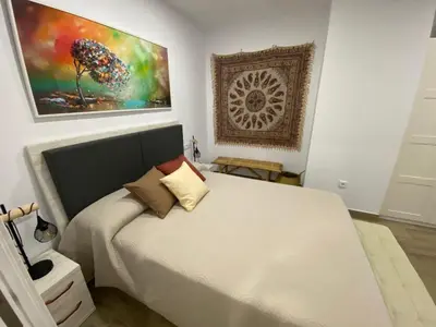 Cama o camas de una habitación en LA SUITE DES COULEURS - Apartamento en pleno centro de Córdoba