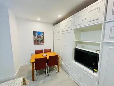 Una televisión o centro de entretenimiento en Ecclesia Major Apartment - Vivienda con Fines Turísticos Catedral de Jaen