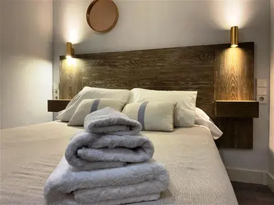 Cama o camas de una habitación en ESTUDIO EN PLENO CENTRO de SEVILLA by MSHOLIDAYS