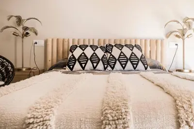 Cama o camas de una habitación en Jardines de Colón
