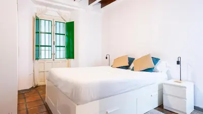 Cama o camas de una habitación en Alohamundi Alcázares