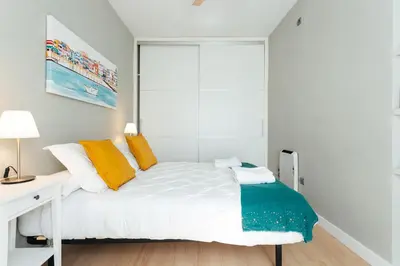 Cama o camas de una habitación en Alohamundi Dúplex Alameda