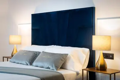 Cama o camas de una habitación en Apartamentos Casa del Arco de 2 a 6 personas