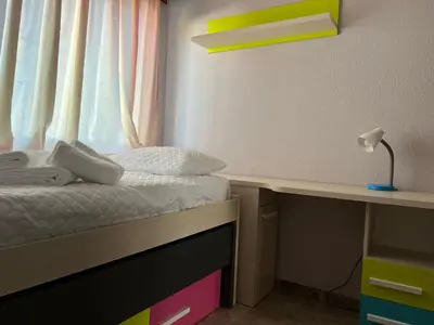 Cama o camas de una habitación en Piso familiar con perfecta ubicación