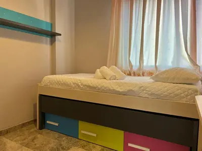 Cama o camas de una habitación en Piso familiar con perfecta ubicación