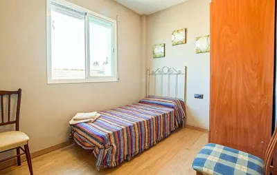Cama o camas de una habitación en La Aracelitana