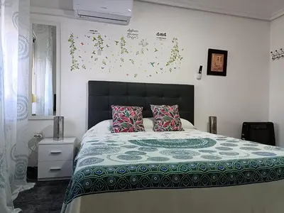 Cama o camas de una habitación en Casa Oasis Puertollano, una casa en un entorno rural en Puertollano, agradable, con Piscina en zona tranquila