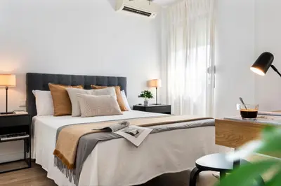 Cama o camas de una habitación en AvantiStays Luz de Sevilla