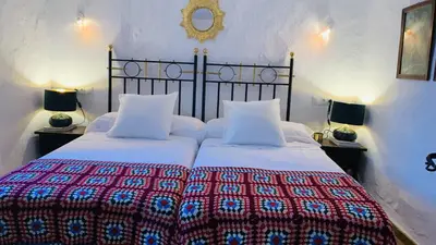 Cama o camas de una habitación en Casa Rural Faltriquera Setenil
