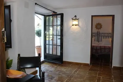 Una televisión o centro de entretenimiento en Casa Rural Faltriquera Setenil