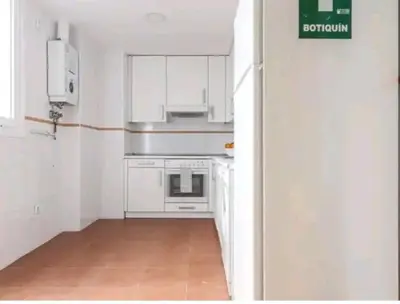 Una cocina o zona de cocina en Apartamento con patio y piscina cerca de Sevilla
