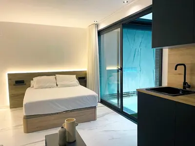 Cama o camas de una habitación en Apartamentos Turísticos Córdoba Boutique Con jacuzzi