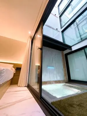 Cama o camas de una habitación en Apartamentos Turísticos Córdoba Boutique Con jacuzzi