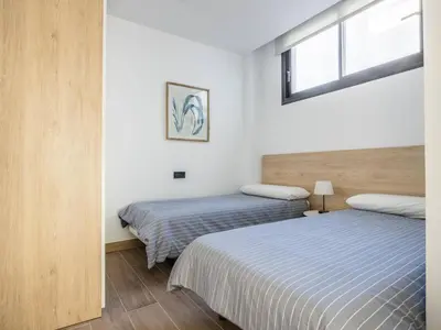 Cama o camas de una habitación en Nervión Suites 1 - Vacacional Sevilla