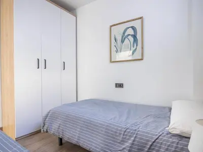 Cama o camas de una habitación en Nervión Suites 1 - Vacacional Sevilla