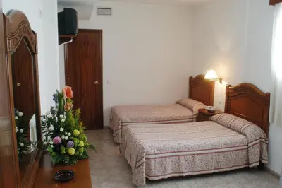 Cama o camas de una habitación en Hotel Riviera