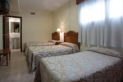 Cama o camas de una habitación en Hotel Riviera