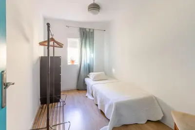 Cama o camas de una habitación en Colours Apartment and Garage Historical Center 4 pax