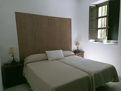 Cama o camas de una habitación en Estación de Coripe