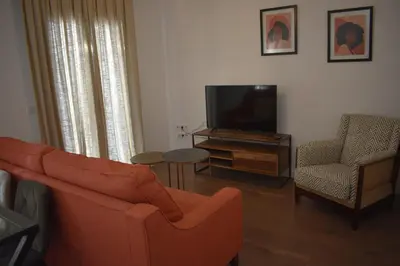 Una televisión o centro de entretenimiento en Apartamentos Molinos