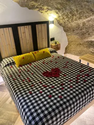 Cama o camas de una habitación en Casa Rural Bajo la Alcazaba