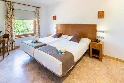Cama o camas de una habitación en Hotel Riad Arruzafa