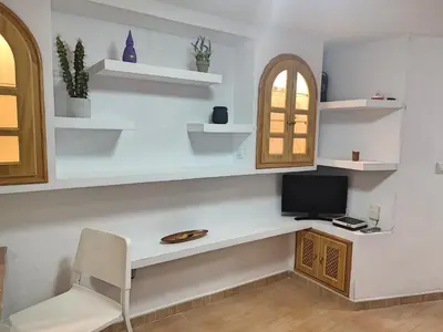 Una televisión o centro de entretenimiento en Apartamento Dama de Noche