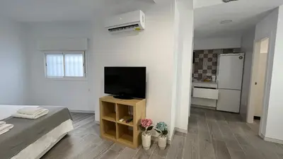 Una televisión o centro de entretenimiento en Apartamento Piedra Escrita