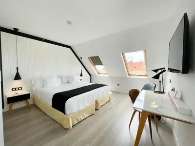 Cama o camas de una habitación en Vértice Sevilla