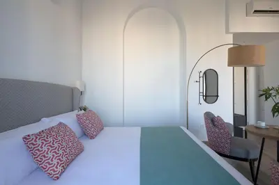 Cama o camas de una habitación en Coliseum Boutique Apartments