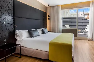 Cama o camas de una habitación en Catalonia Giralda