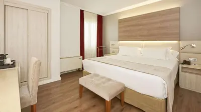 Cama o camas de una habitación en NH Córdoba Califa