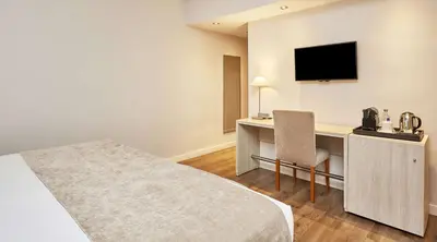 Cama o camas de una habitación en NH Córdoba Califa