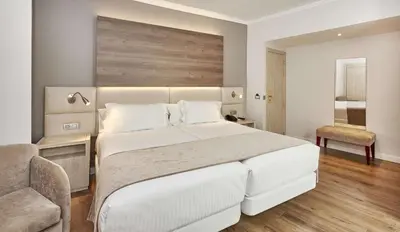 Cama o camas de una habitación en NH Córdoba Califa