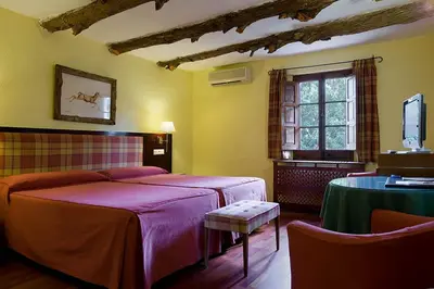 Cama o camas de una habitación en Hotel la Perdiz