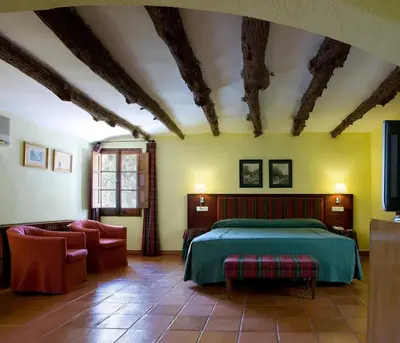 Cama o camas de una habitación en Hotel la Perdiz