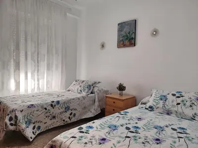 Cama o camas de una habitación en Apartamento La Muralla de San Lorenzo