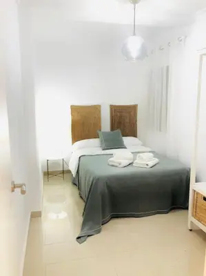 Cama o camas de una habitación en Nieves Viejas Apartamento Fresco con patio en Córdoba
