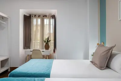 Cama o camas de una habitación en Hotel Boutique Puerta del Rincón