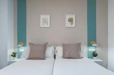 Cama o camas de una habitación en Hotel Boutique Puerta del Rincón
