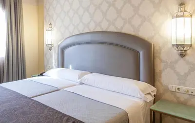 Cama o camas de una habitación en Hotel Macià Alfaros