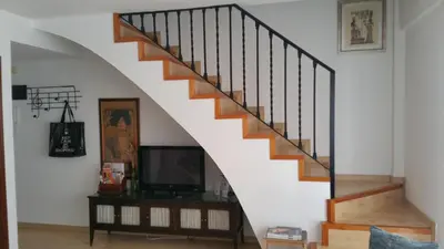 Una televisión o centro de entretenimiento en Acogedor dúplex en el centro - Wifi