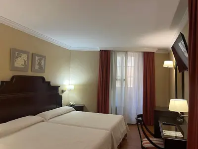 Cama o camas de una habitación en Hotel Santo Domingo Lucena