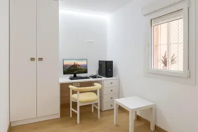Una televisión o centro de entretenimiento en Céntrico Apartamento en Jaén 107 m2 2 baños 4 pax