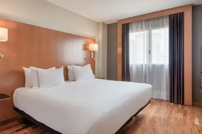 Cama o camas de una habitación en AC Hotel Sevilla Fórum by Marriott