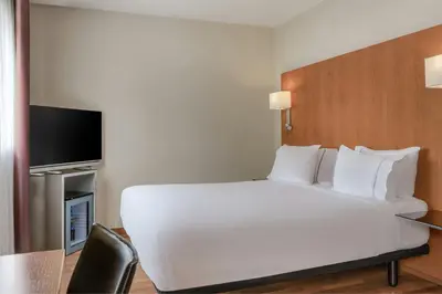Cama o camas de una habitación en AC Hotel Sevilla Fórum by Marriott