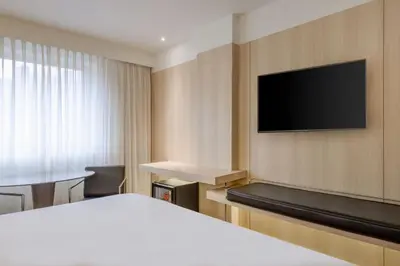 Una televisión o centro de entretenimiento en AC Hotel Córdoba by Marriott