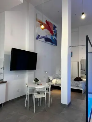 Una televisión o centro de entretenimiento en Loft familiar 