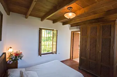 Cama o camas de una habitación en Villa El Lagar Rocabella