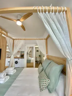Cama o camas de una habitación en LOFT DELUXE ALMA GARDEN